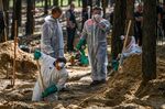A forensics team works at&nbsp;the&nbsp;site of a mass grave near&nbsp;Izyum, Ukraine, in September.
