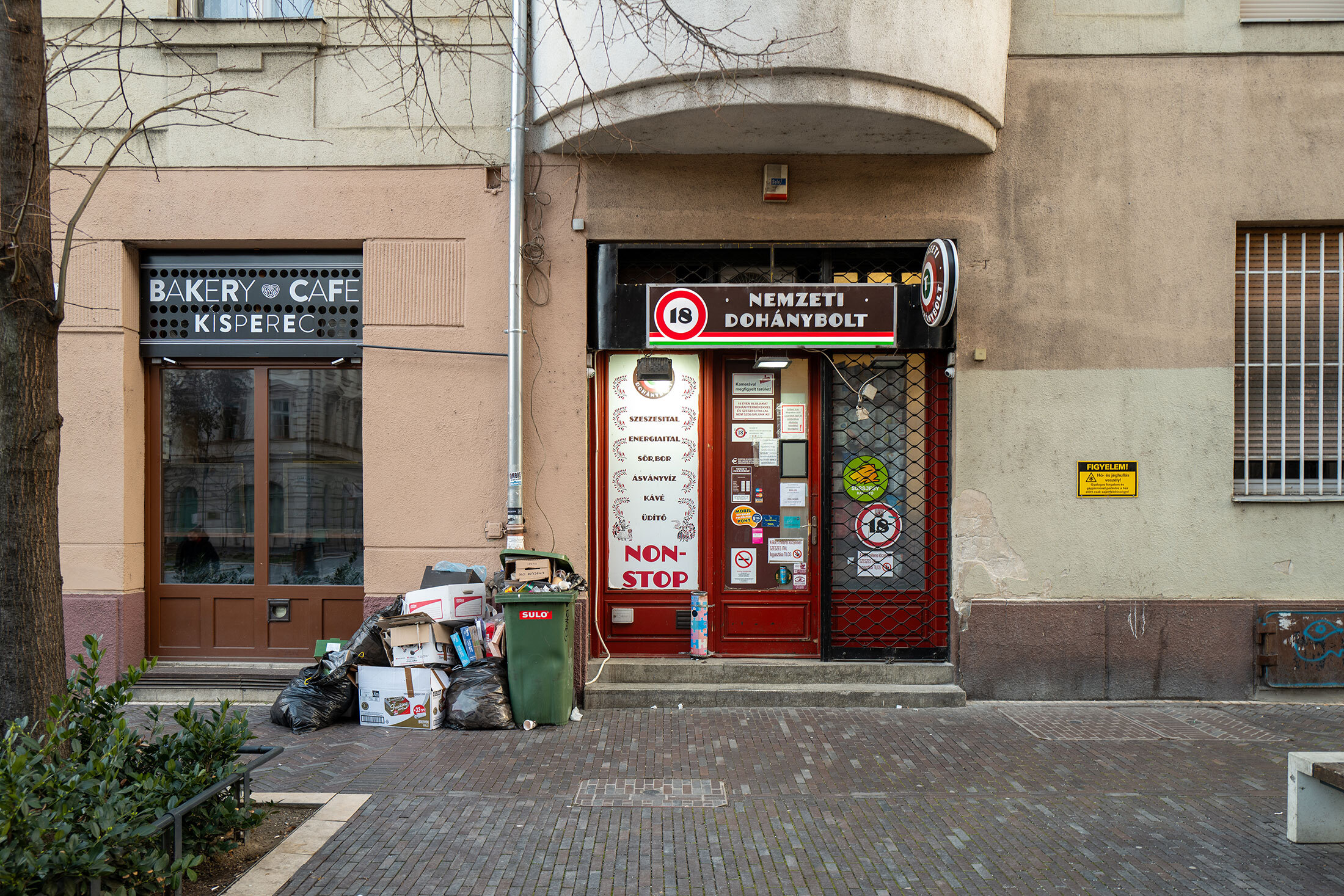 CAPTION: Budapest, Hungary - March 2nd 2025: Trash piled outside a Hungarian state owned tobacco shop Photographer: Getty Images