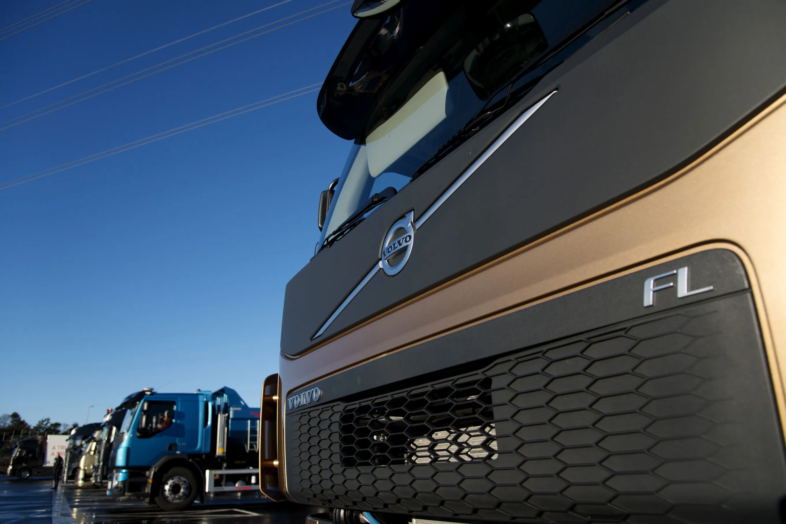 The company logo sits on the front of a Volvo FL heavy goods truck outside the Volvo AB demo center in Gothenburg.