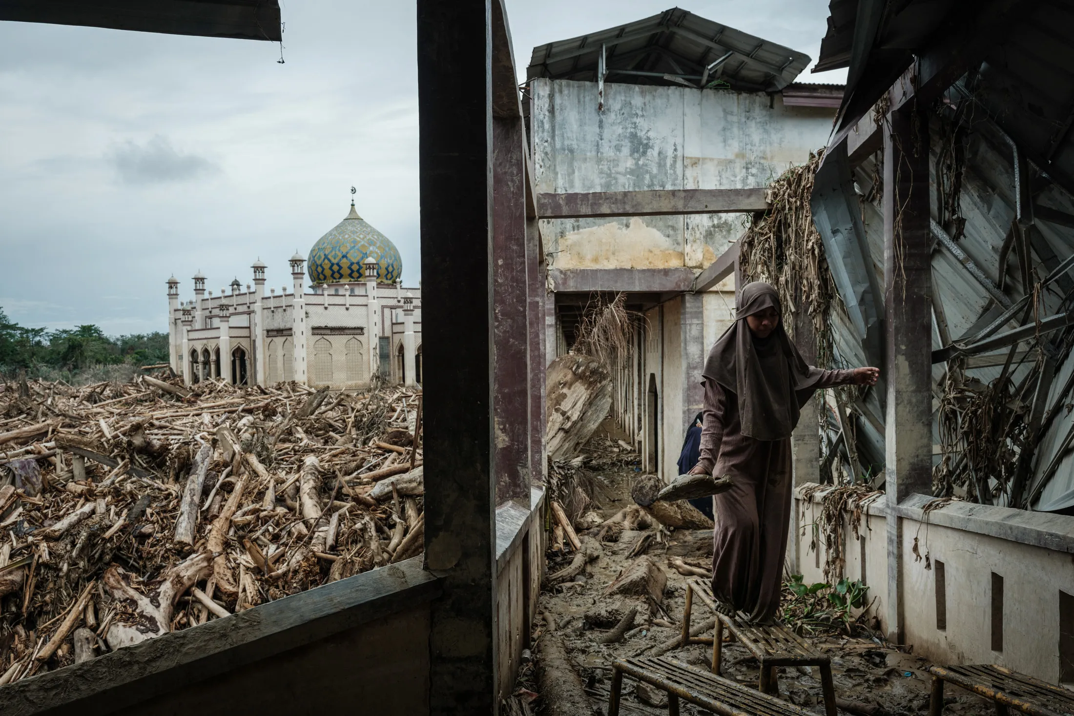 Thick rafts of timber at a&nbsp;boarding school and mosque in Karang Baru, northern Sumatra, on Dec. 14.