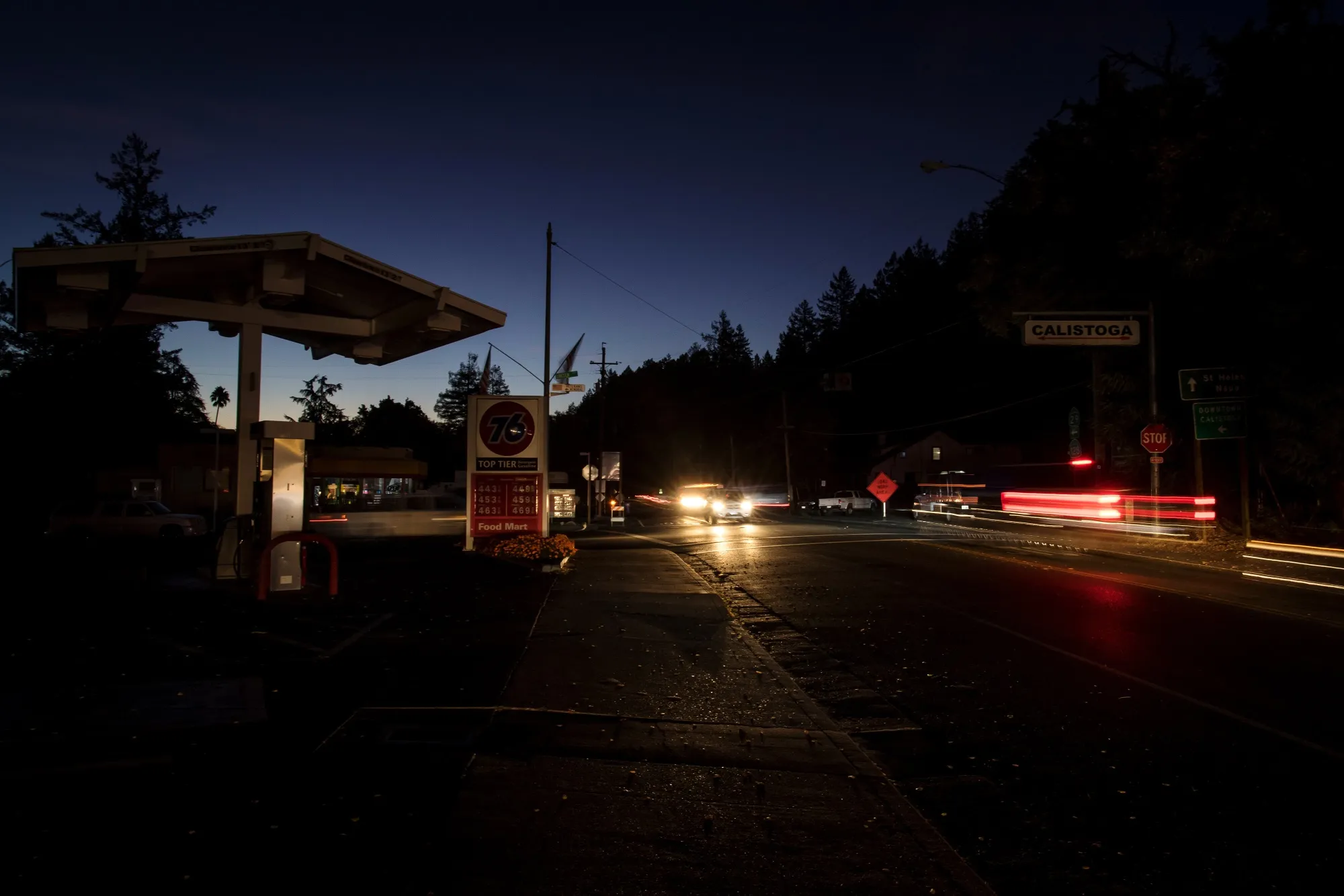 Traffic moves past a gas station during a blackout in Calistoga, California on Oct. 24.