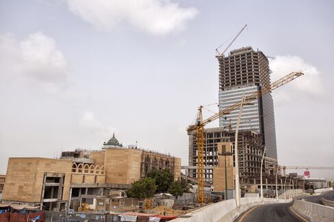 Bahria Town Icon stands next to a Sufi shrine
