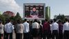 TOPSHOT - Spectators listen to a television news brodcast of a statment by North Korean leader Kim Jong-Un, before a public television screen outside the central railway station in Pyongyang on September 22, 2017. US President Donald Trump is "mentally deranged" and will "pay dearly" for his threat to destroy North Korea, Kim Jong-Un said on September 22, as his foreign minister hinted the regime may explode a hydrogen bomb over the Pacific Ocean. / AFP PHOTO / Ed JONES (Photo credit should read ED JONES/AFP/Getty Images)