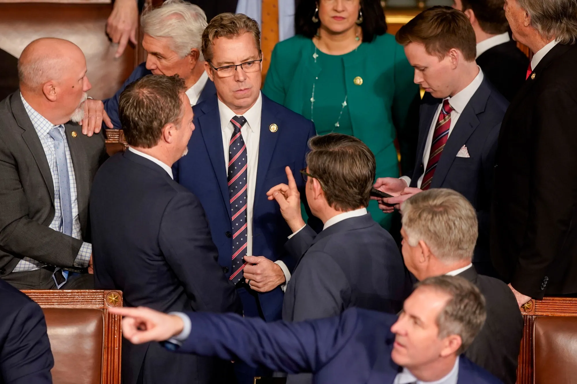 House Speaker Mike Johnson, center right, speaks to Representative Andy Ogles, a Republican from Tennessee, center.