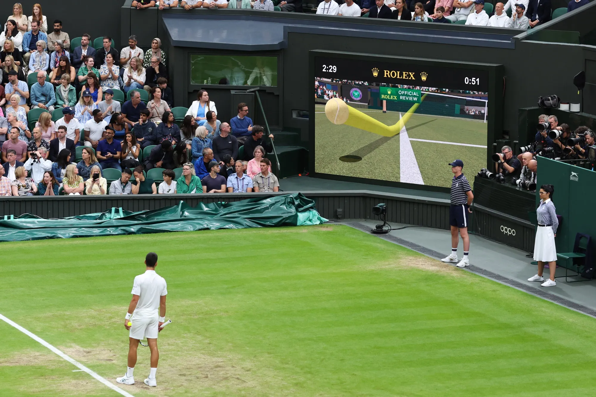 Novak Djokovic watches Hawk-Eye’s ball tracking tech during the 2023 Wimbledon.