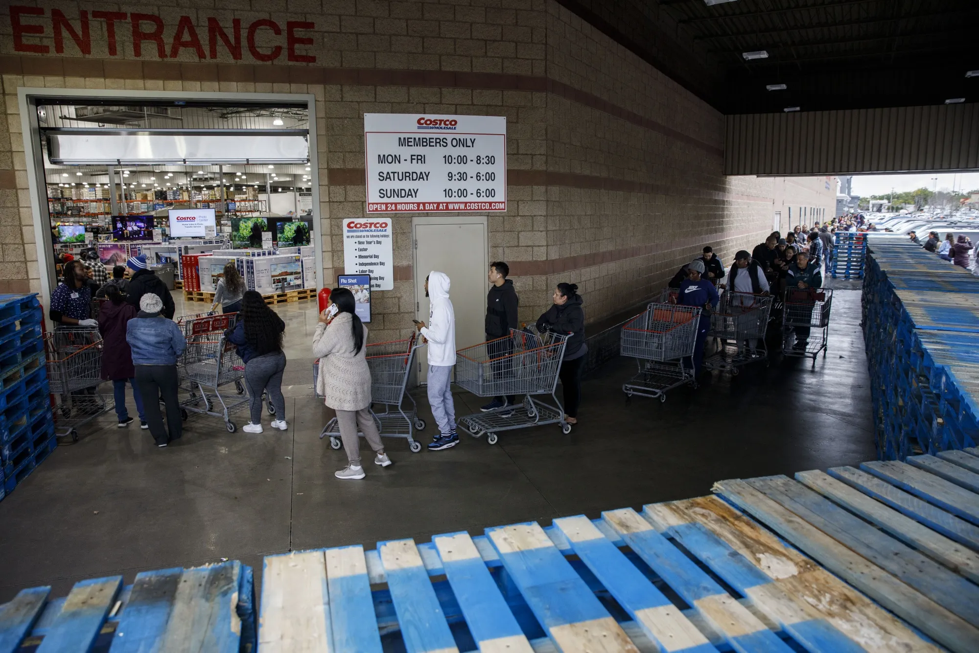 Shoppers wait in line at a&nbsp;Costco location in Hawthorne, California on March 14.
