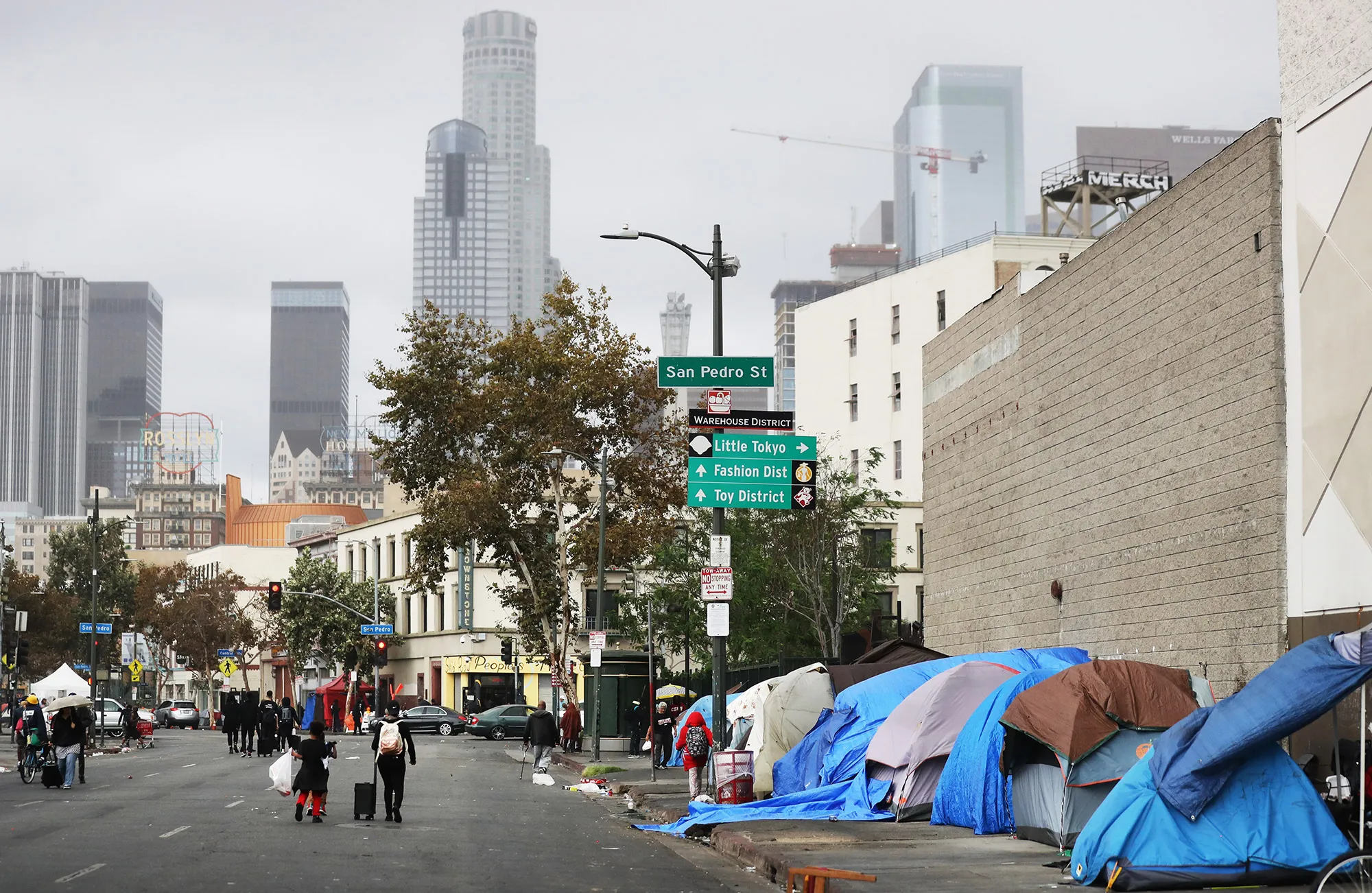People walk in Skid Row after new school supplies were donated in Los Angeles, California.