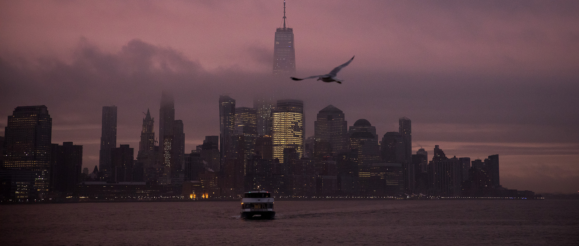A ferry moves along the Hudson River in Hoboken, New Jersey.