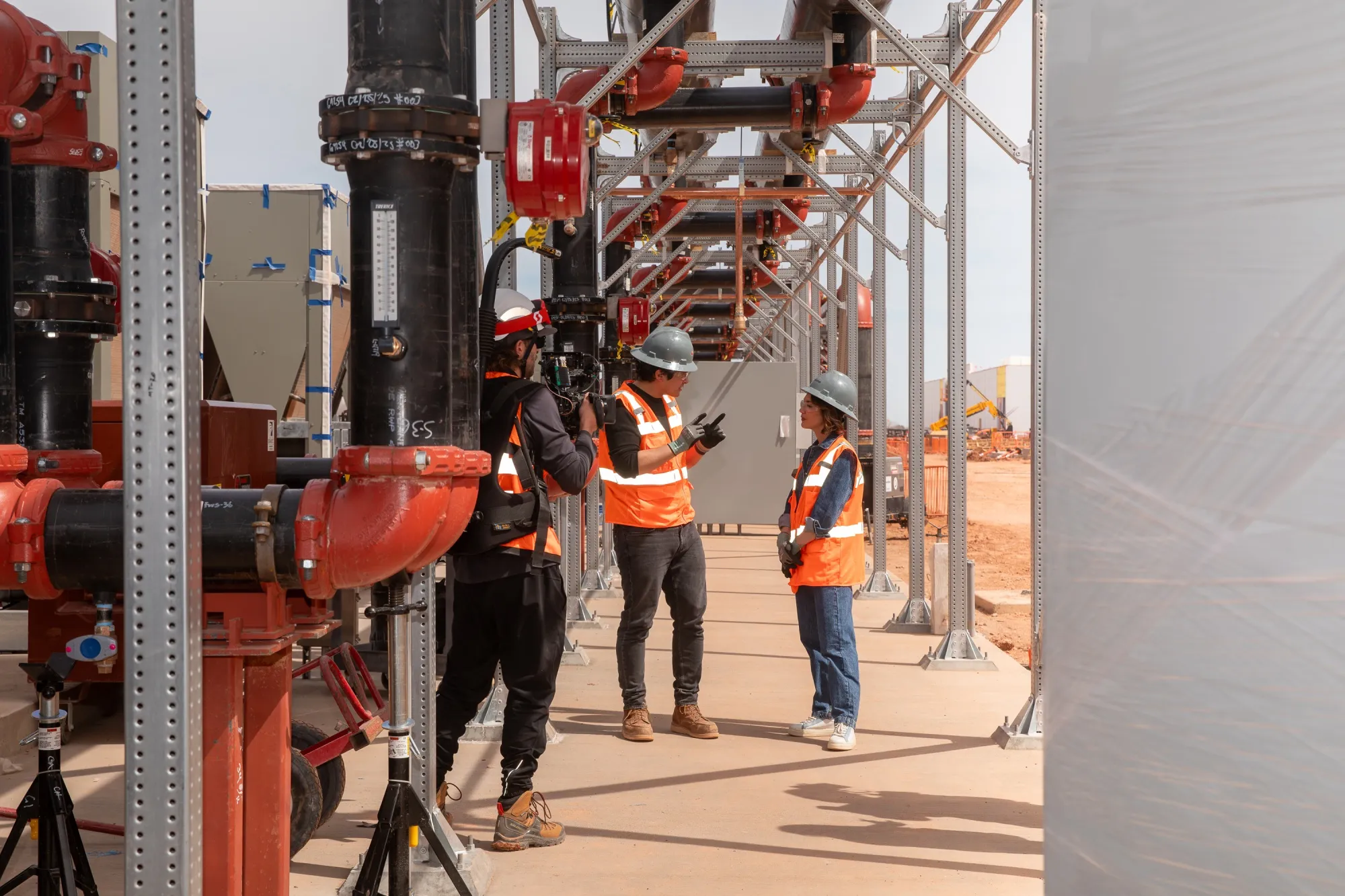 Emily Chang speaks with developer Chase Lochmiller, chief executive officer of Crusoe,&nbsp;at the OpenAI Stargate project construction site in Abilene, Texas.&nbsp;