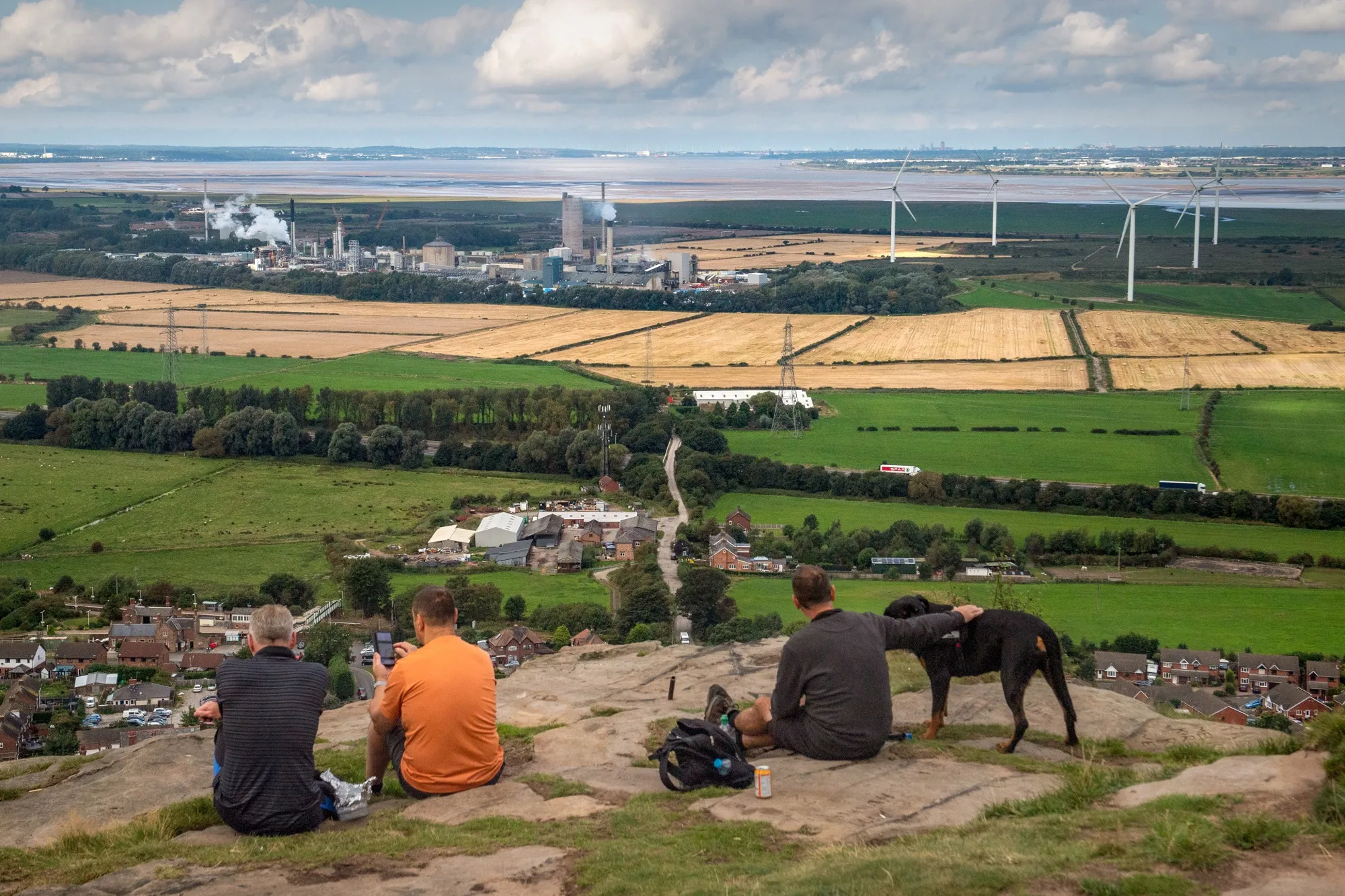 Walkers look towards the CF Industries Holdings Inc. fertilizer manufacturing complex in Ince, UK.&nbsp;