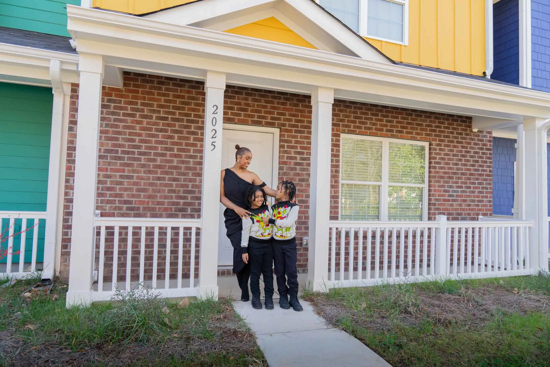 Zayn Bey with her two sons outside her home in Charlotte, North Carolina.