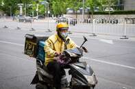 Meituan Couriers As Delivery Giant Raises $10 Billion to Fight Alibaba in Grocery Arena