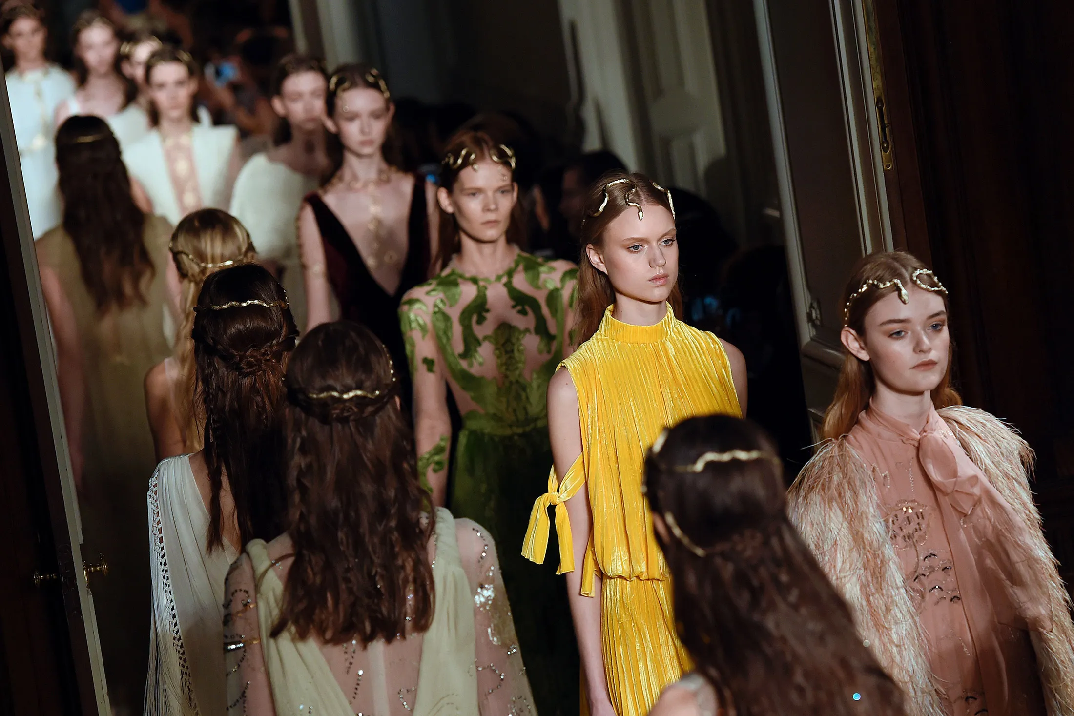 Models present creations for Valentino during the 2016 spring/summer Haute Couture collection on January 27, 2016 in Paris.
