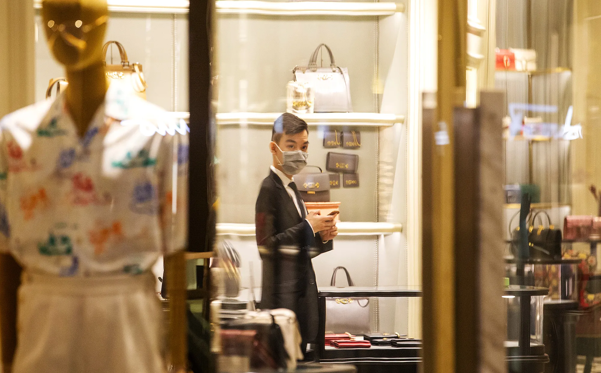 A shop assistant&nbsp;works in Sydney on Jan. 31.