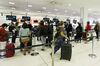 Passengers check-in for Air New Zealand flight destined for Wellington, in Sydney on April 19.