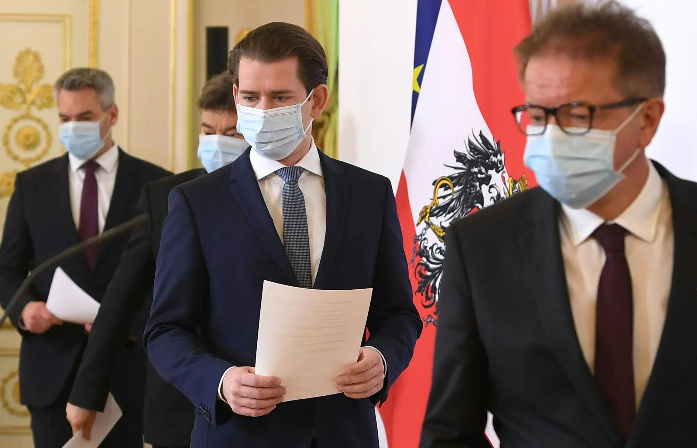 Sebastian Kurz, second right,&nbsp;arrives for a press conference in Vienna on April 6.