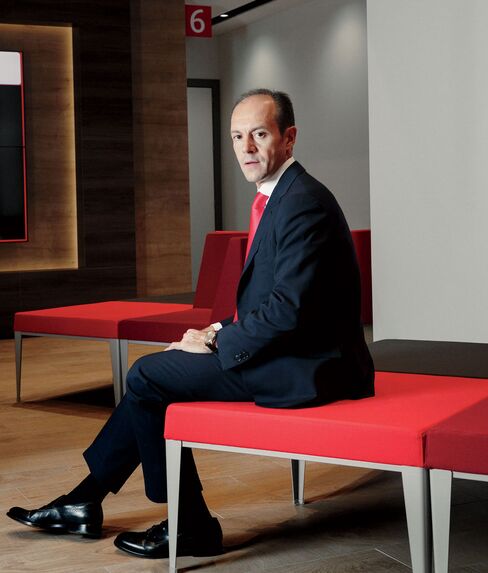Rami Aboukhair, Santander’s Spain country head, visits a newly remodeled branch in Madrid.