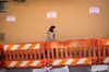 A pedestrian wearing a face mask walks in the Chinatown district of San Francisco, California, U.S., on Wednesday, Feb. 26, 2020. 