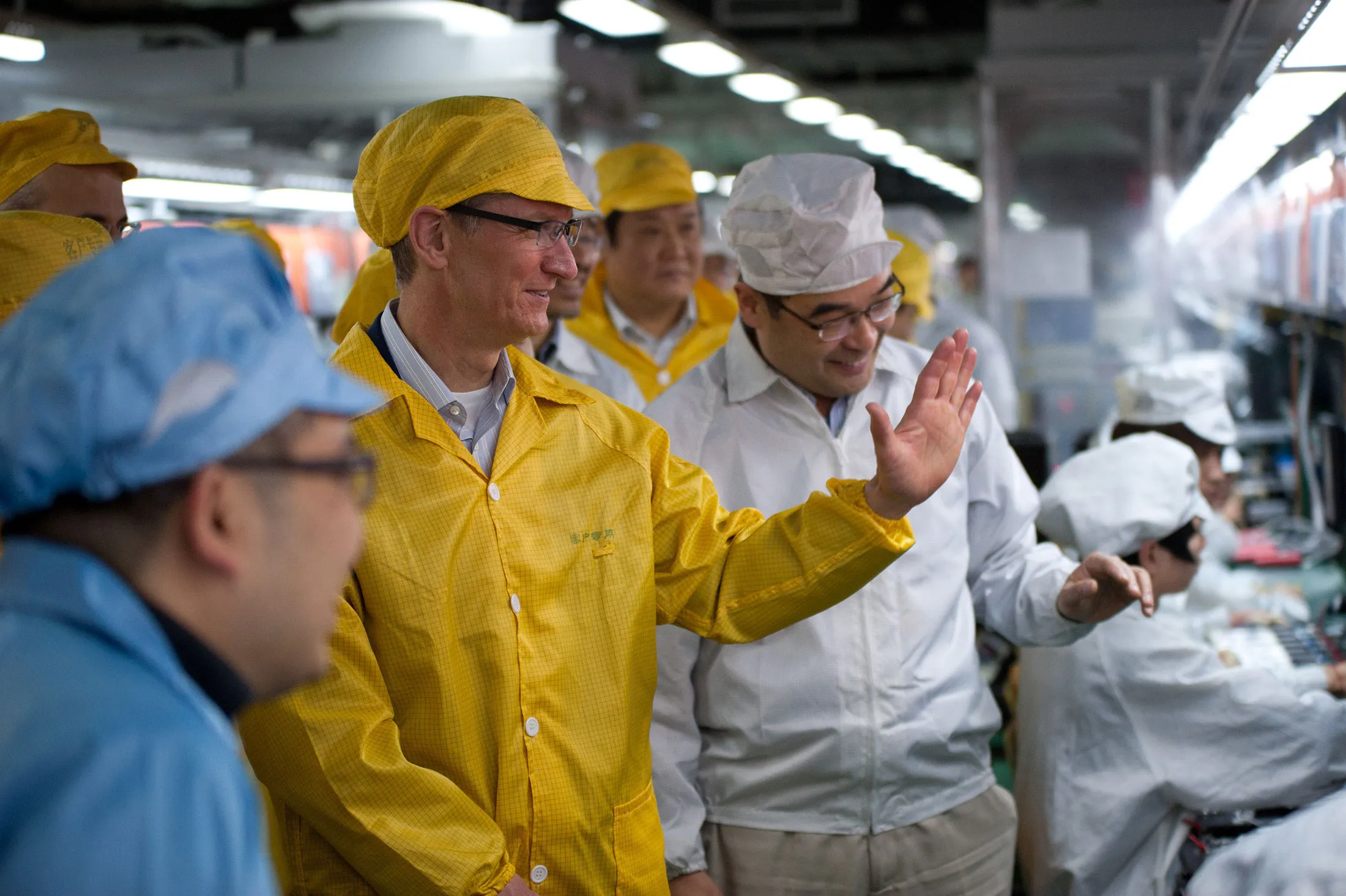 Apple CEO Tim Cook visits an iPhone production line at the Foxconn facility in Zhengzhou, China, in 2012.
