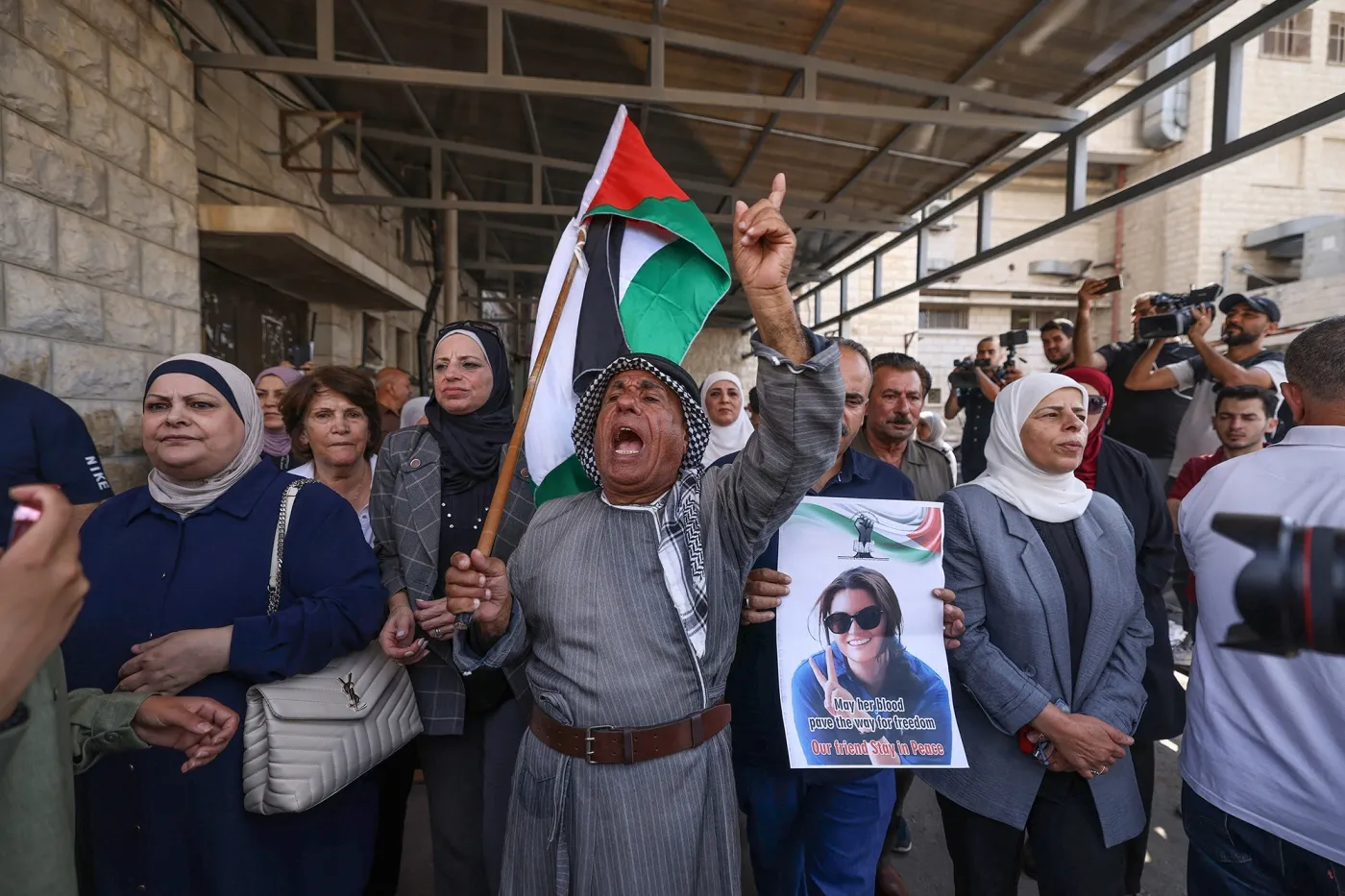 Palestinians and international activists lift portraits of&nbsp;Aysenur Ezgi Eygi at her final farewell at the Rafidia hospital&nbsp;in Nablus in the occupied West Bank on Sept. 8.