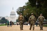 Members of the National Guard patrol near the US Capitol on the National Mall in Washington, DC, US, on Monday, Sept. 29, 2025. National Guard troops deployed to Washington, DC for President Donald Trump's "safe and beautiful mission" are set to keep working in the city, without pay, if the US government shuts down over a funding dispute between the White House and congressional Democrats. Photographer: Al Drago/Bloomberg