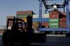 A dock worker operates a forklift truck as shipping containers stand stacked beyond at the container terminal operated by Piraeus Container Terminal SA (PCT), at the Port of Piraeus, in Piraeus, Greece, on Monday, Sept. 17, 2018. The trade route known in Beijing as the Belt and Road Initiative is spurring $1 trillion of investment on rail, highways and ports linking Europe and Asia.