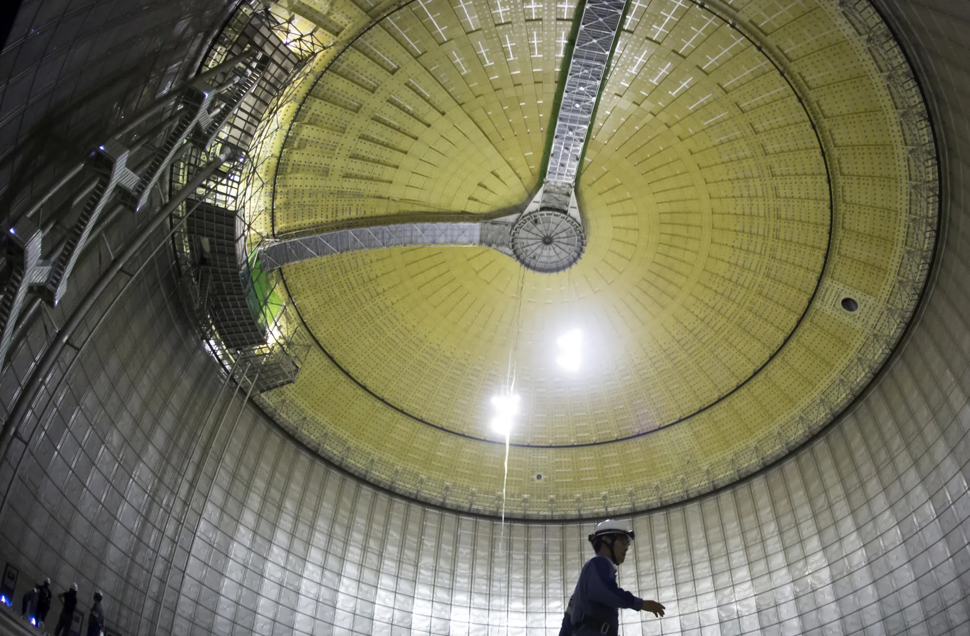 An employee walks inside a&nbsp;liquefied natural gas (LNG) storage tank under construction.&nbsp;