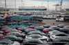 Tesla Inc. vehicles are unloaded from car carriers before being shipped from the Port of San Francisco in San Francisco, California, U.S., on Thursday, Feb. 7, 2019. Tesla is loading as many Model 3 sedans as it can onto vessels destined for China ahead of March 1, when a trade-war truce between presidents Donald Trump and Xi Jinping is scheduled to expire.