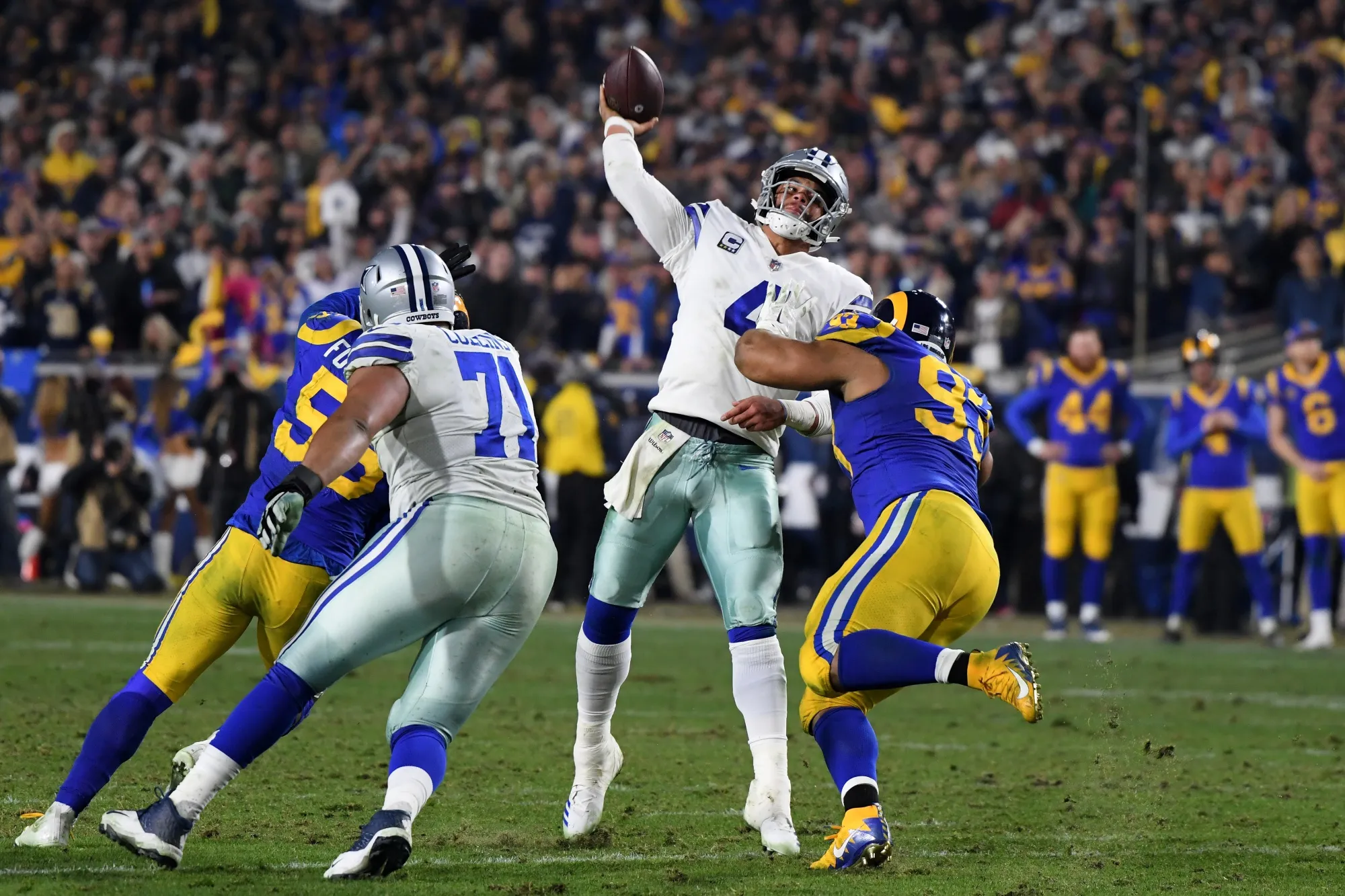 LOS ANGELES, CA - JANUARY 12: Dak Prescott #4 of the Dallas Cowboys passes in the fourth quarter against Ndamukong Suh #93 of the Los Angeles Rams in the NFC Divisional Playoff game at Los Angeles Memorial Coliseum on January 12, 2019 in Los Angeles, California. (Photo by Harry How/Getty Images)