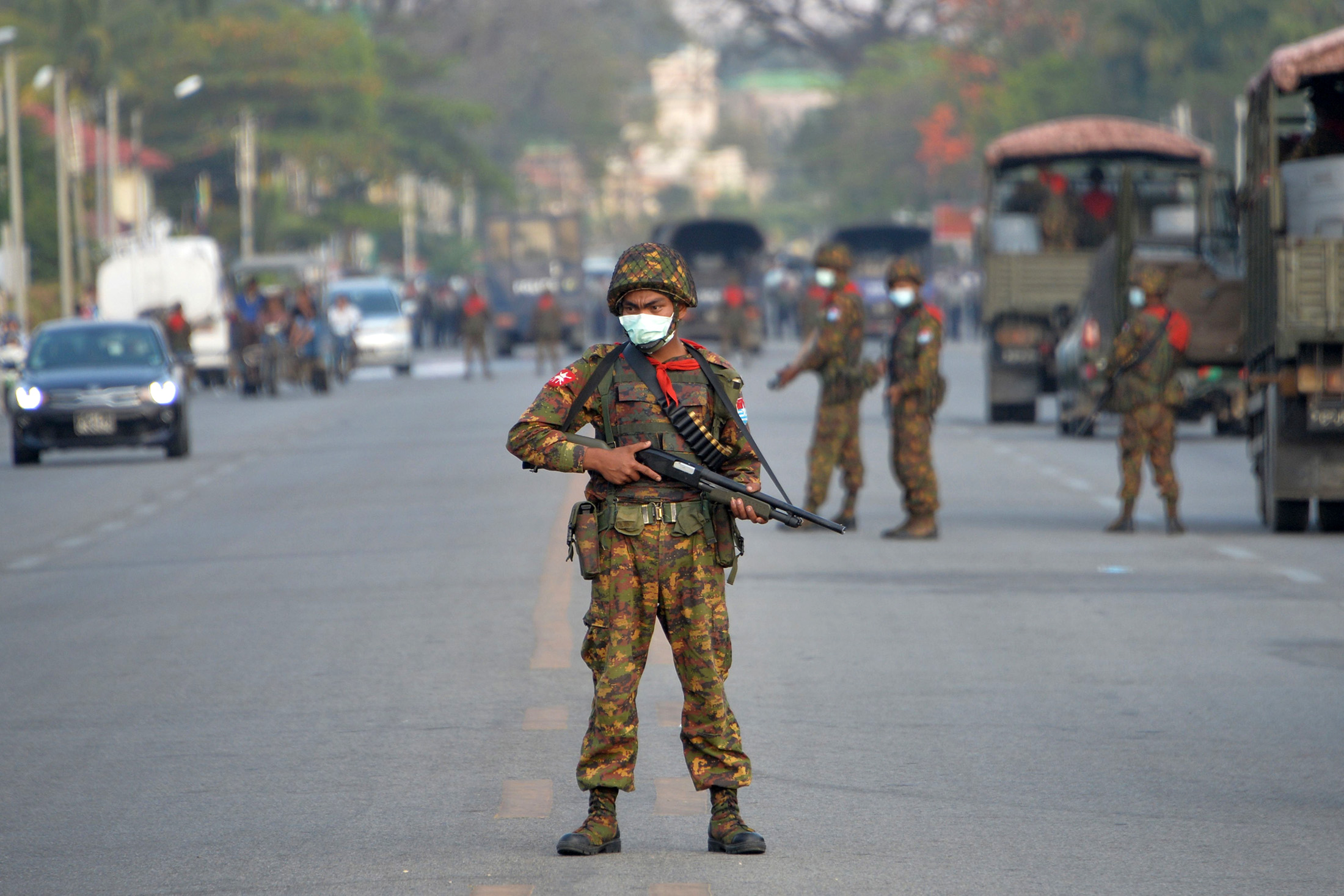 An armed soldier on a road amid demonstrations against the military coup in Naypyidaw on Feb.&nbsp;17.