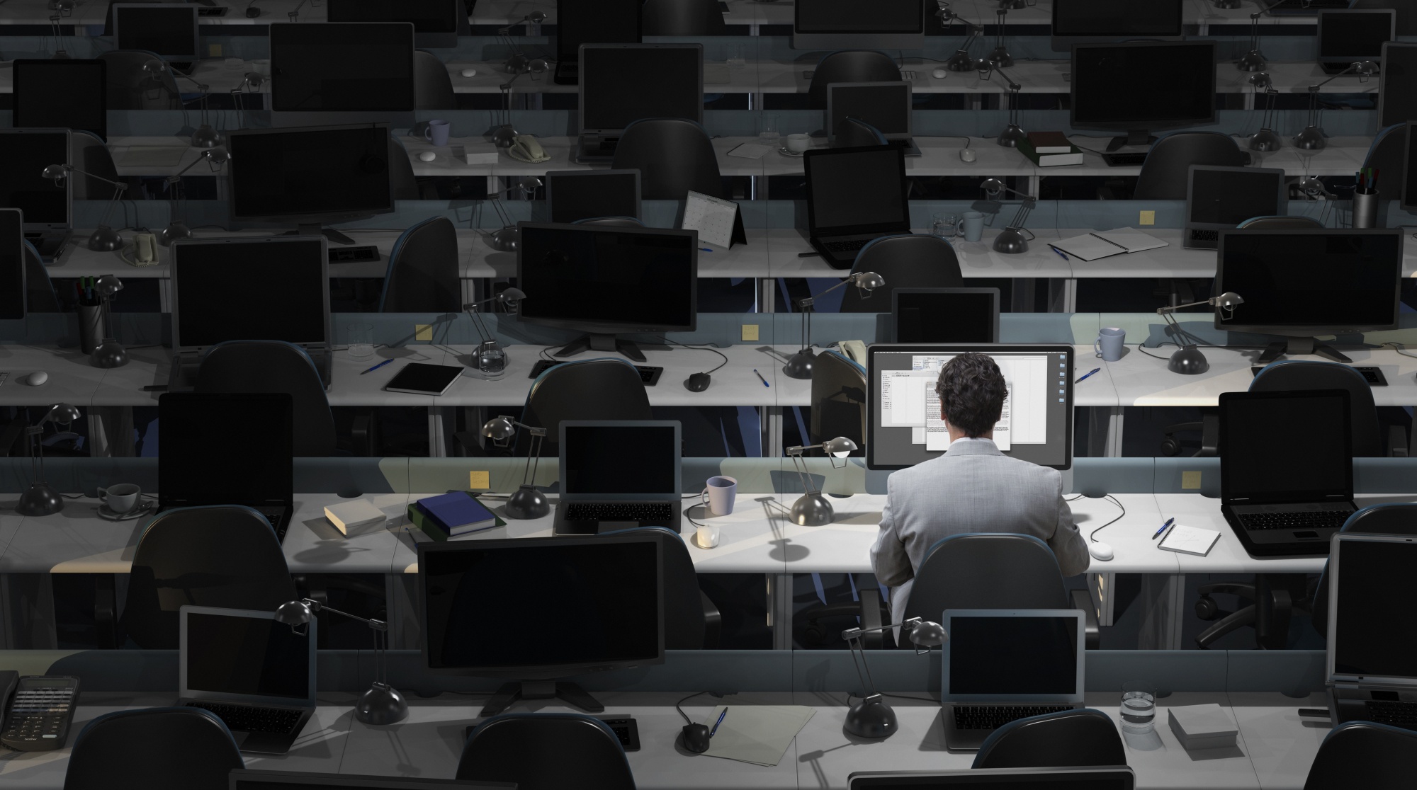 An employee working in an empty office