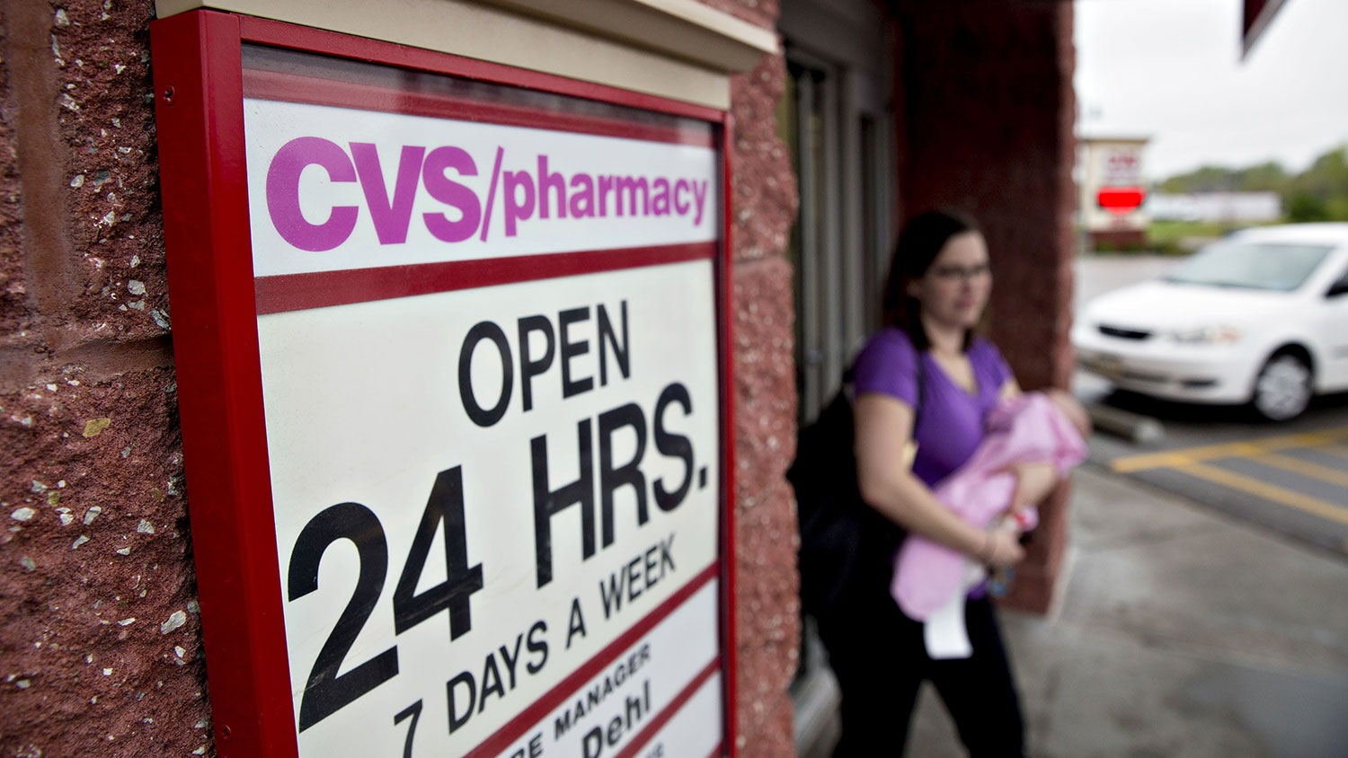 A customer exits a CVS Health Corp. pharmacy in La Vista, Nebraska, on April 30, 2016.
