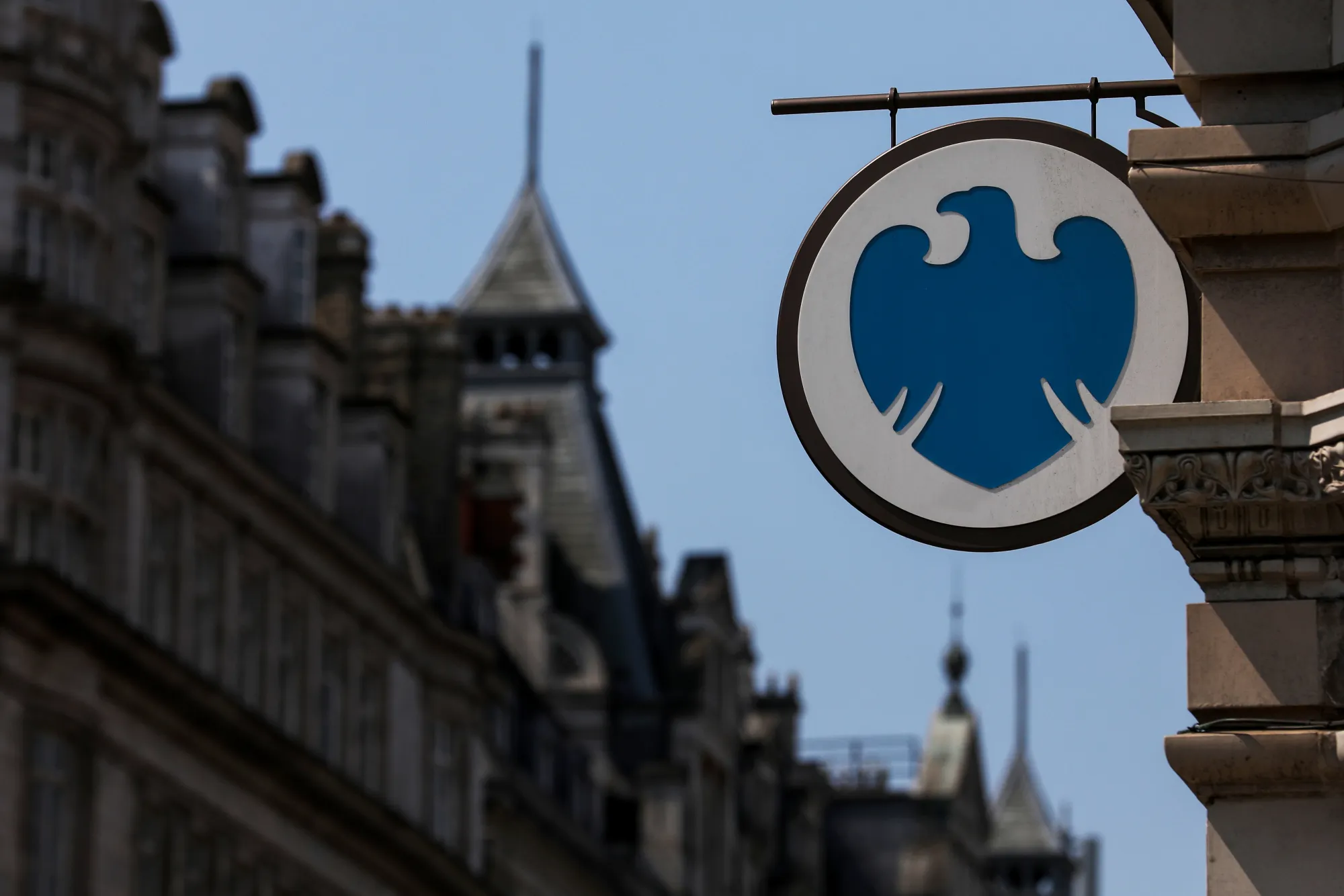 A sign hangs outside a Barclays Plc bank branch in London, U.K., on Tuesday, June 20, 2017.
