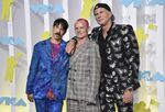 Anthony Kiedis, from left, Flea and Chad Smith, of Red Hot Chili Peppers, appear at the MTV Video Music Awards on Aug. 28, 2022, in Newark, N.J. Live Nation said Monday the band will perform at a set of stadium shows and festivals across North America and Europe beginning March 29. (Photo by Evan Agostini/Invision/AP, File)
