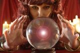 Fortune teller looking into crystal ball