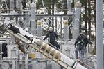 Linesmen repair one of the&nbsp;substations&nbsp;that were attacked&nbsp;in December in North Carolina.&nbsp;