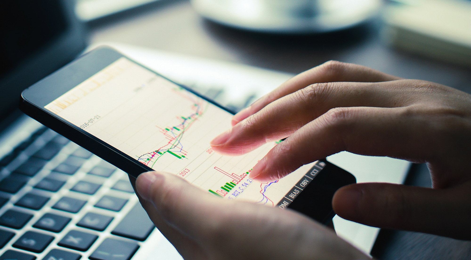 analyzing chart on mobile phone