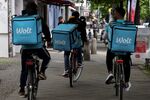 Food delivery cyclists, working for Wolt Enterprises Oy, in Berlin, Germany.