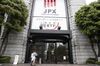 Pedestrians walk towards the Tokyo Stock Exchange (TSE), operated by Japan Exchange Group Inc. (JPX), in Tokyo, Japan, on Friday, April 26, 2019. Japan's retail investors have propelled their net long yen positions against the dollar to near a record ahead of the nation's extended Golden Week holidays.