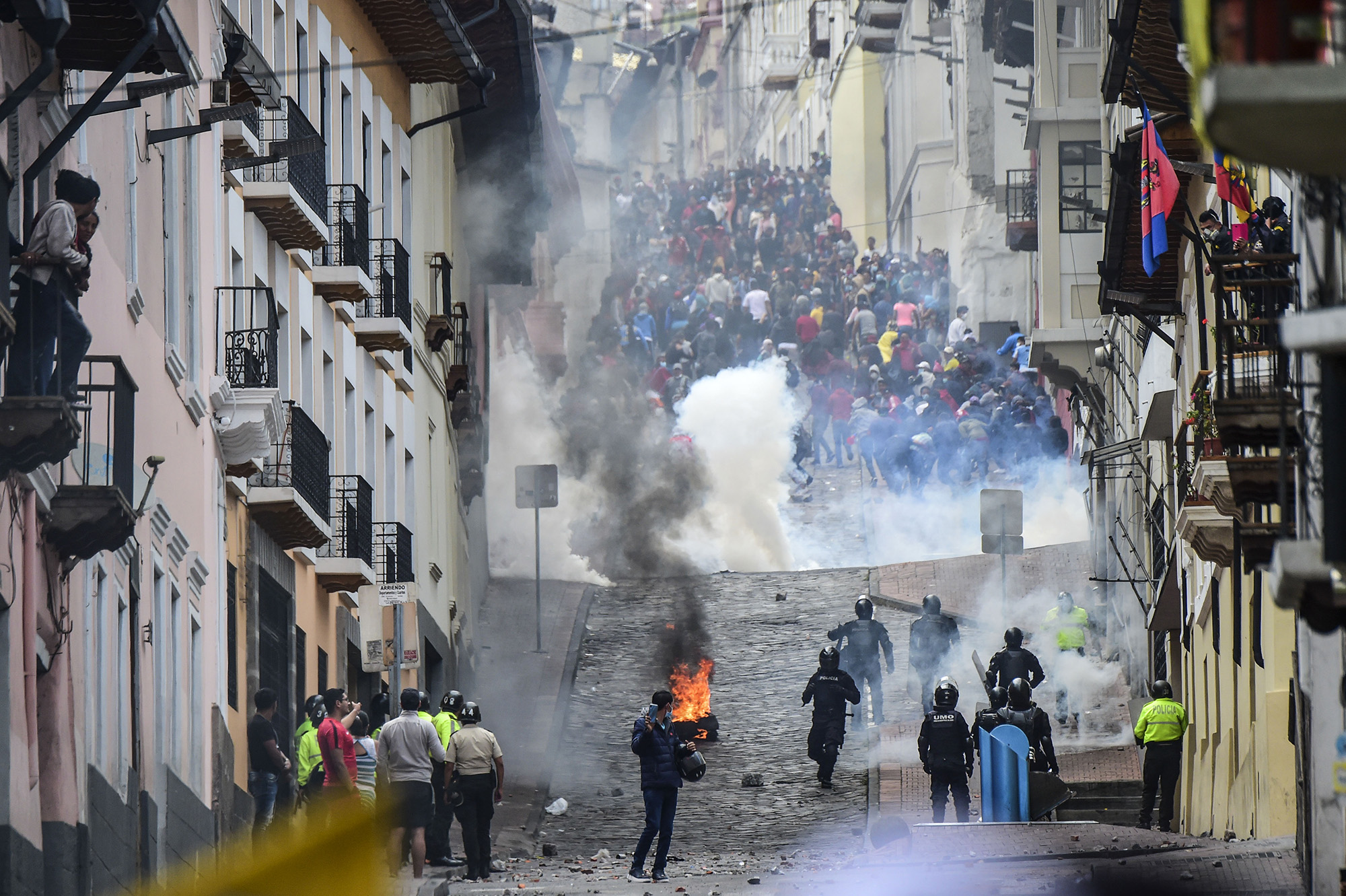 Riot police confront demonstrators during clashes in Quito on Oct. 9.