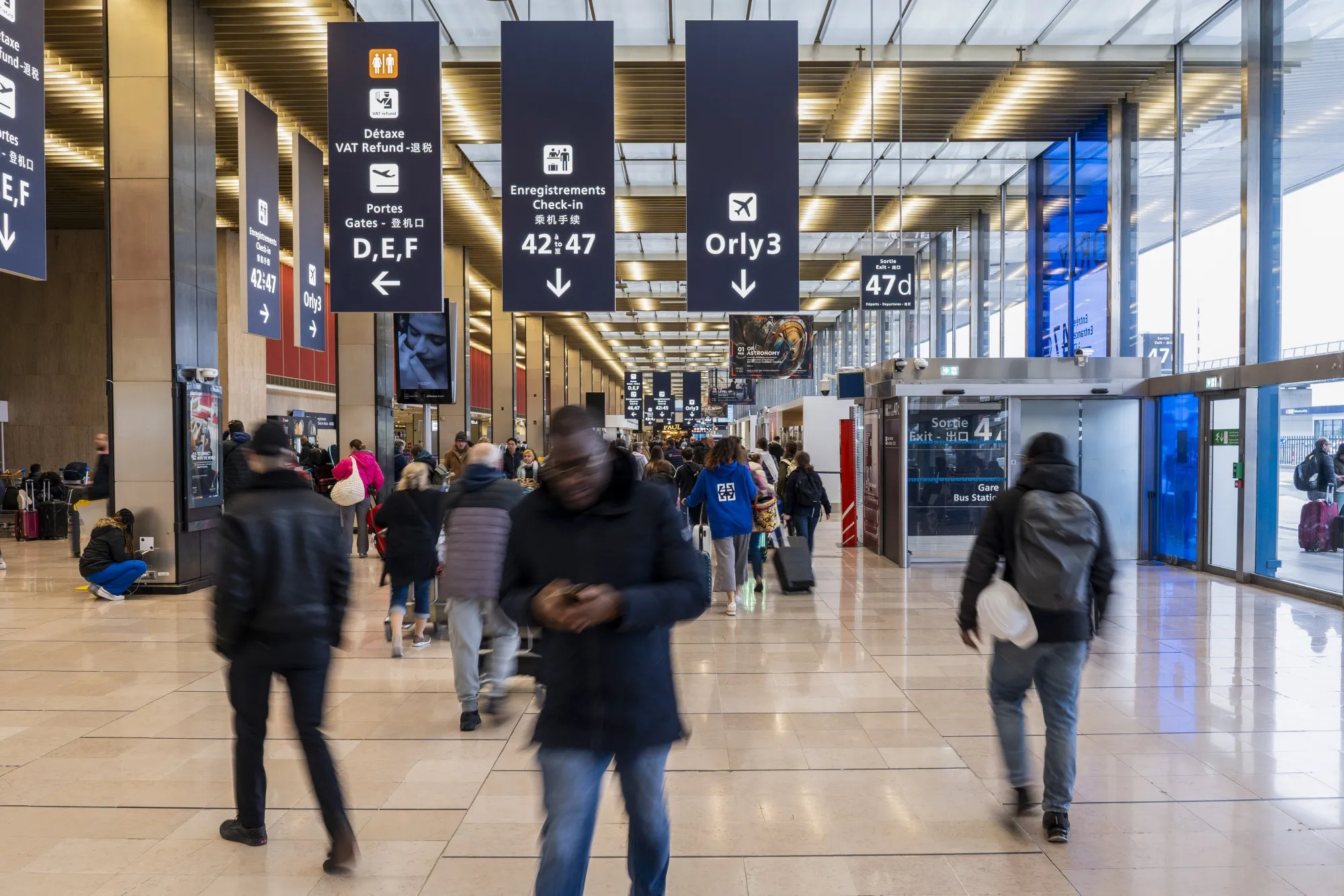 Passengers in the departures hall at Paris-Orly Airport.
