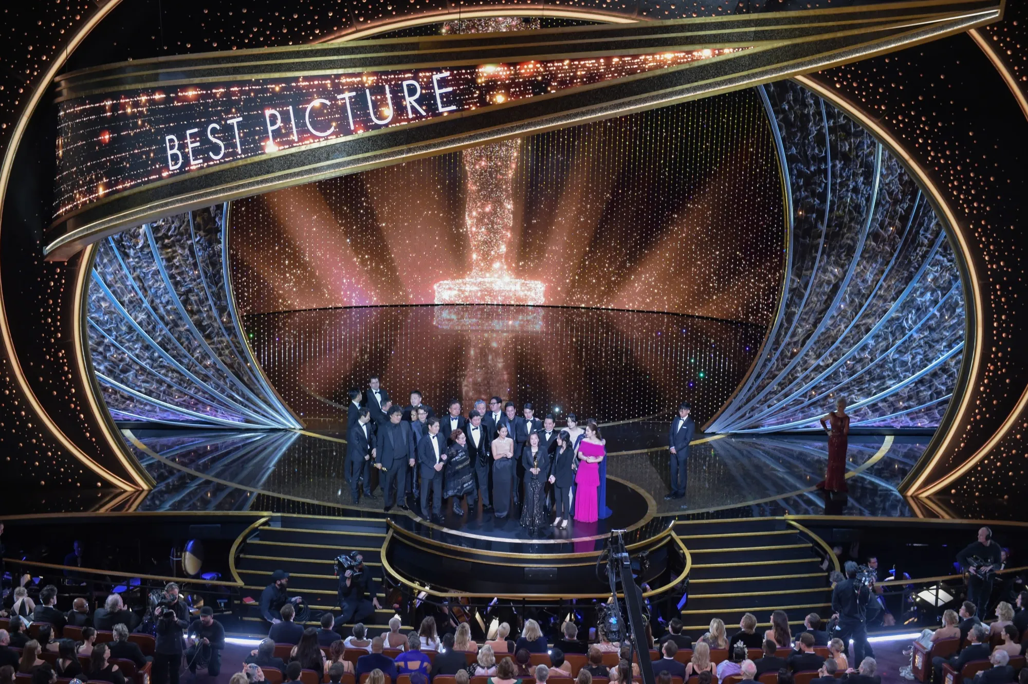 "Parasite" producers accepting the Oscars in 2020.