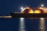 Picture of LNG tanker in port at night.