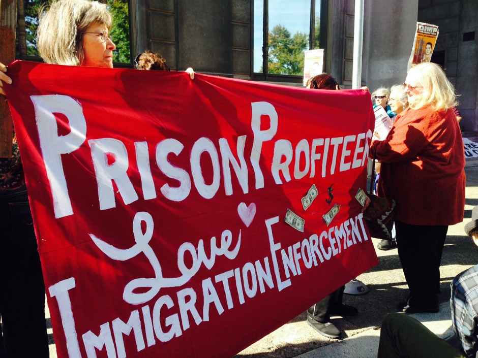 Immigration activists in Portland, Oregon, at a protest against Wells Fargo, which has many ties with the private prison industry. 