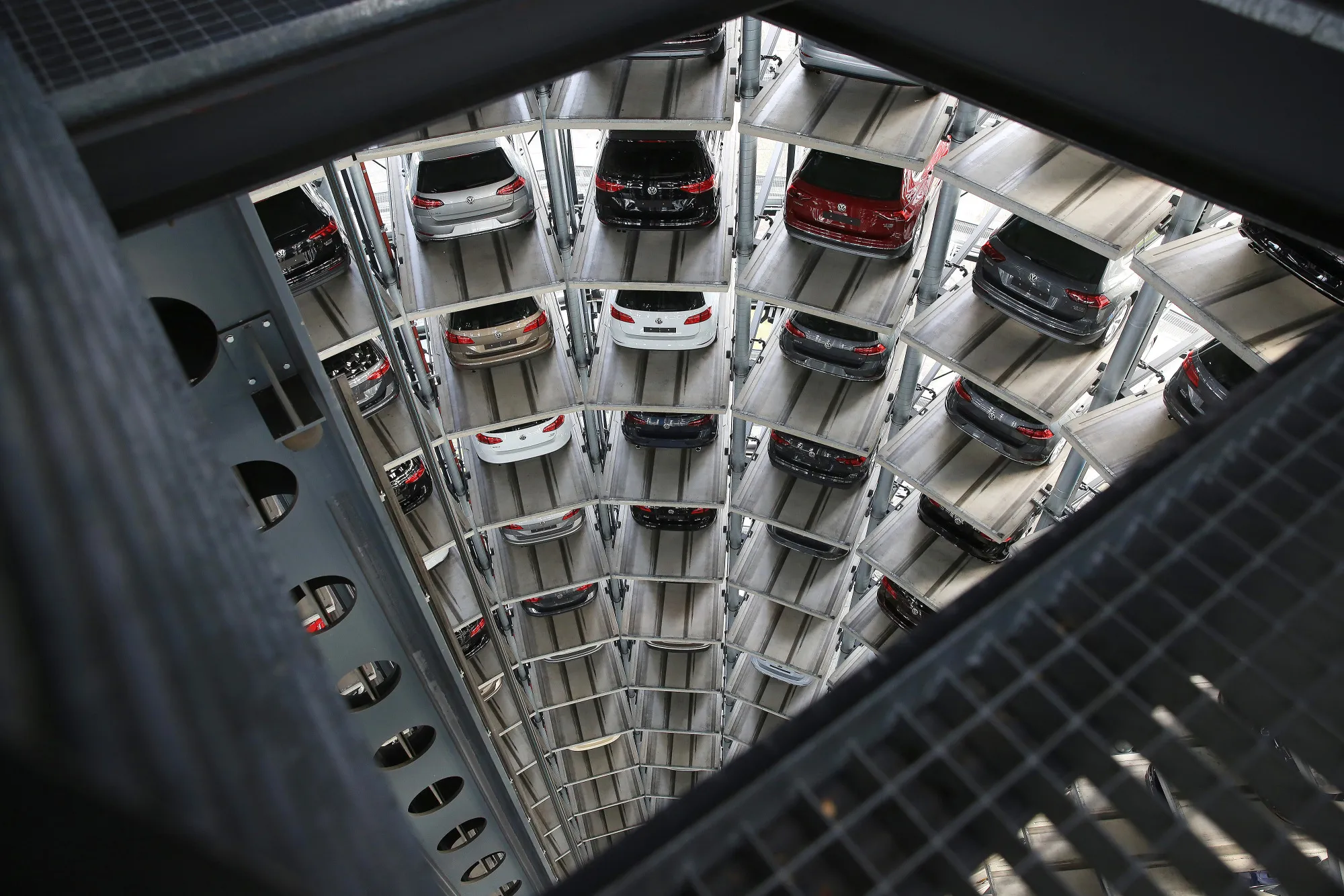 Volkswagen AG (VW) automobiles sit in storage inside a delivery tower&nbsp;at the VW factory in Wolfsburg, Germany.&nbsp;