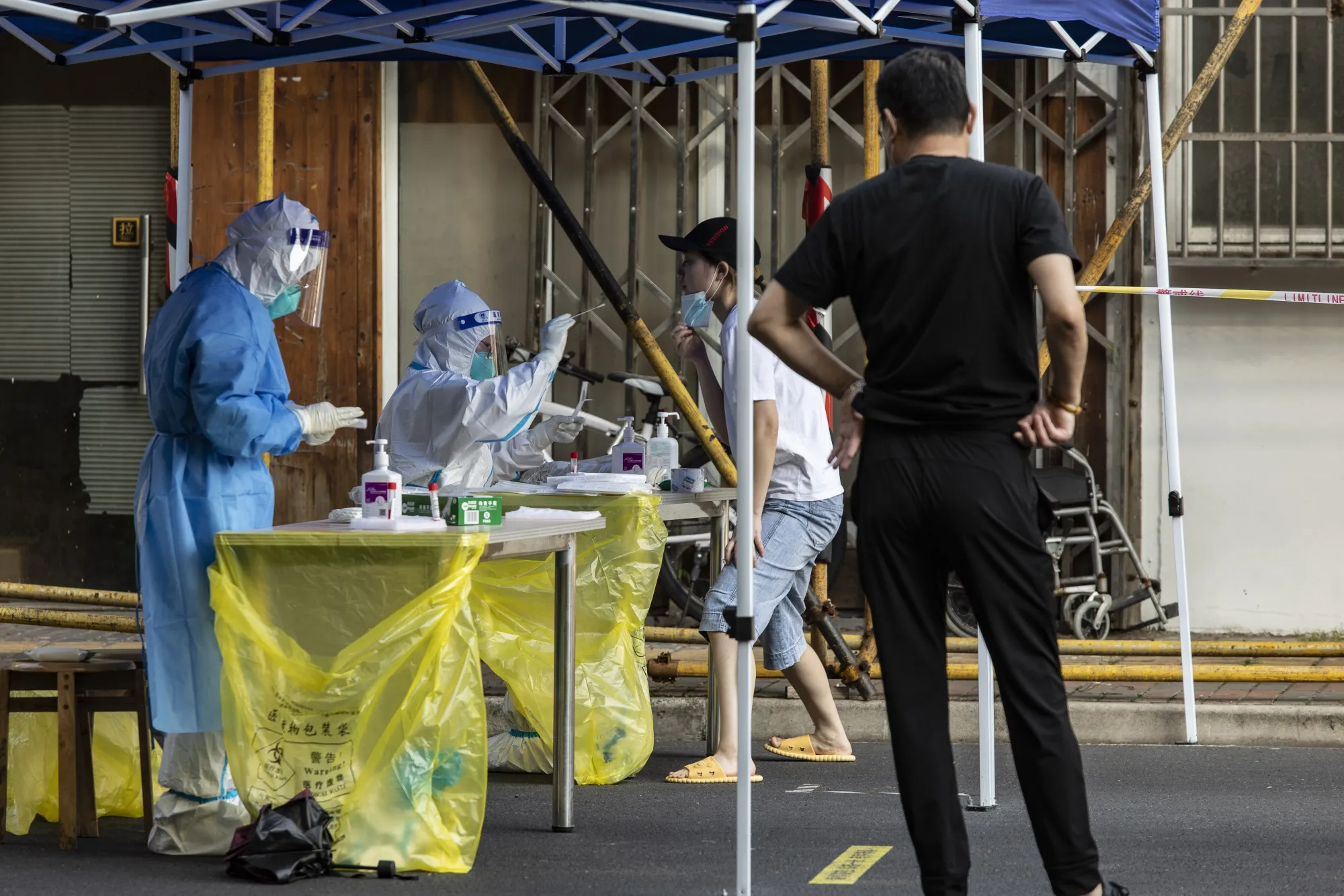 A resident is tested for Covid-19 in Shanghai, on June 18.