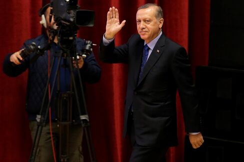 Recep Tayyip Erdogan salutes the audiences before he delivers a speech in Ankara, on May 12, 2016.