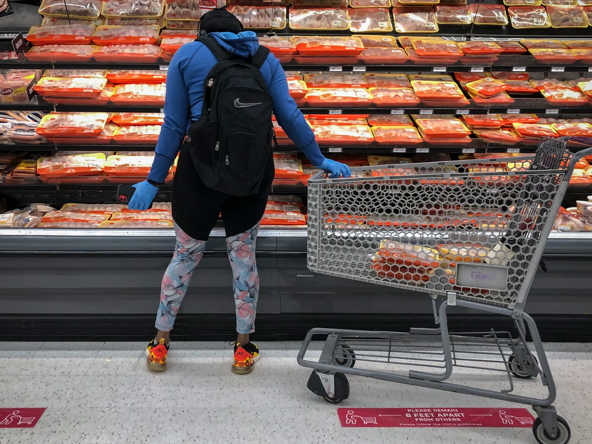 A person shops in the meat section at a grocery store in Washington, D.C. in April.&nbsp;