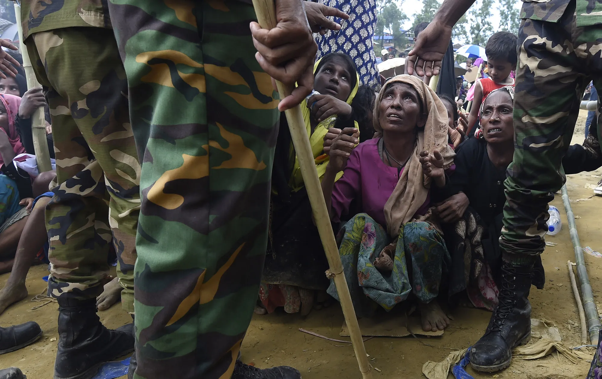 Rohingya refugees wait for food distribution at the refugee camp of Balukhali in Bangladesh in Sept. 2017.