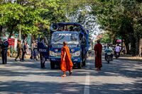 Monks talk to police during an anti-coup demonstration in Mandalay on Feb. 26.